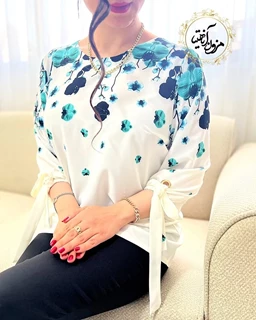 شومیز آستین واشری ریزشی سفید شیری طرح شکوفه باران سبز