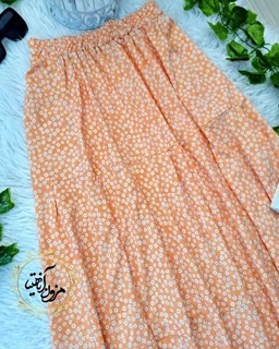 دامن زنانه نیم کلوش نارنجی طرح گلهای سفید گلزار