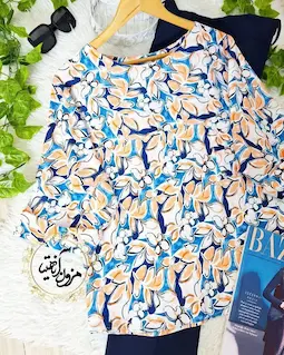 شومیز آستین سه ربع سفید طرح برگ و گلهای سورمه ای نارنجی چیدا