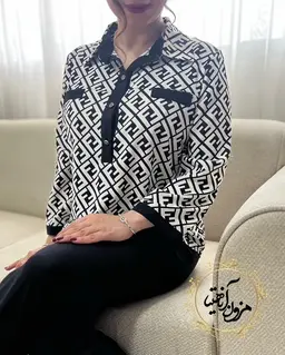 شومیز آستین پاگن دار مشکی سفید طرح سه دکمه فندی آرام