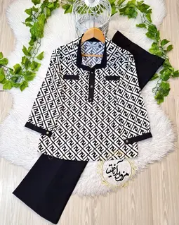 شومیز آستین پاگن دار مشکی سفید طرح سه دکمه فندی آرام