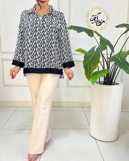 شومیز نیم زیپ مشکی طرح خطی سفید ناستیا