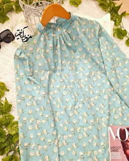 شومیز یقه پیله دار فیروزه ای طرح گلهای سفید ناریا