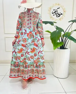 پیراهن ساحلی آبی نارنجی طرح برگ و گلبرگ رامک