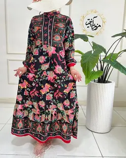 پیراهن ساحلی مشکی طرح برگ و گلبرگ رنگی الینا