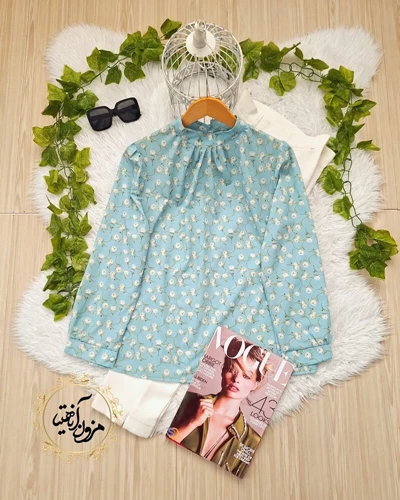 شومیز یقه پیله دار فیروزه ای طرح گلهای سفید ناریا
