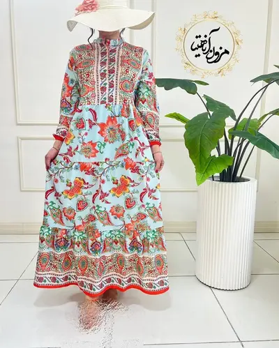 پیراهن ساحلی آبی نارنجی طرح برگ و گلبرگ رامک